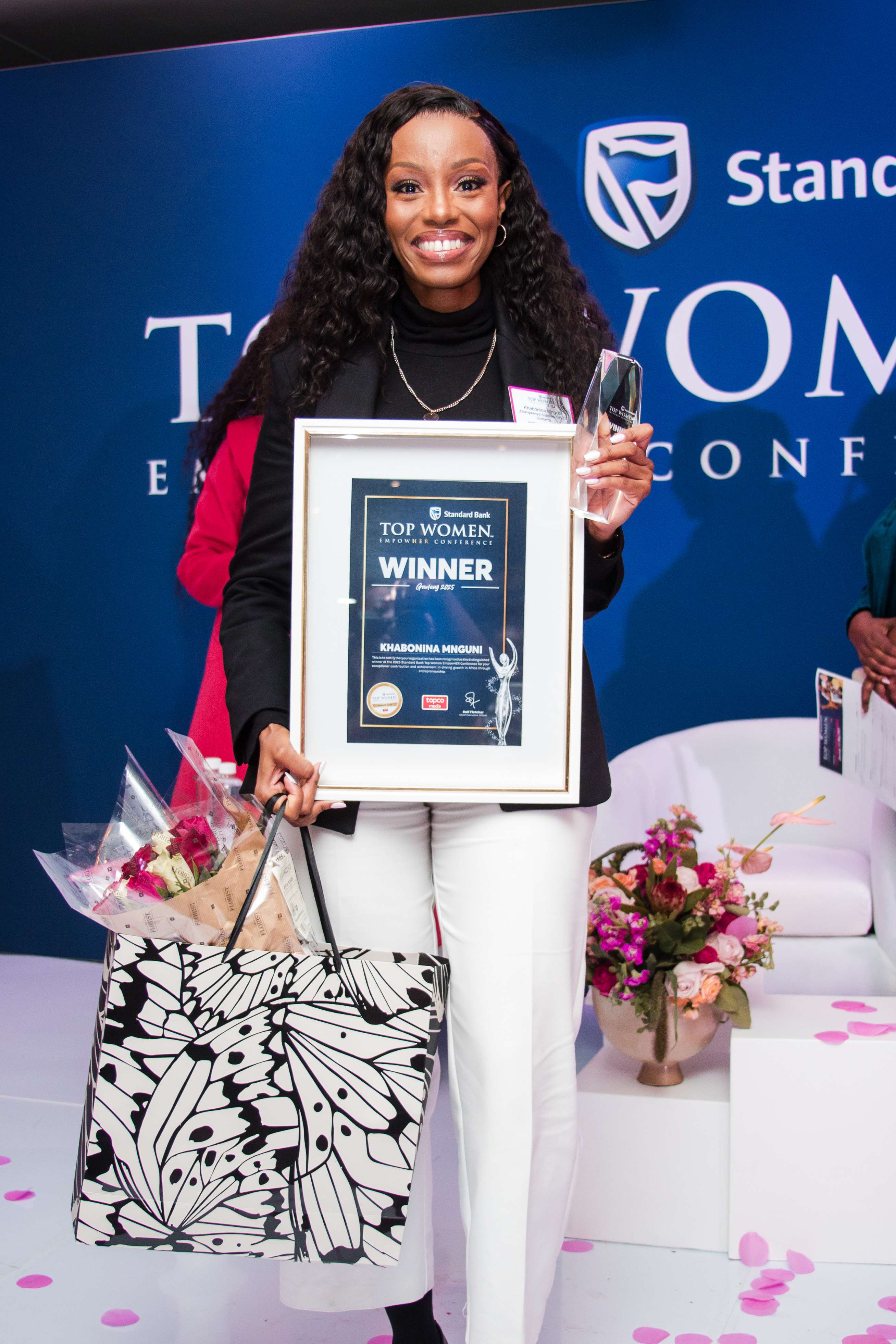 Khabo Mnguni receiving Standard Bank Empower Her Winner 2025 award